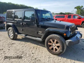2015 Jeep Wrangler Unlimited Sahara with VIN 1C4HJWEGXFL744852, listed as a Copart auction lot 60246145 with 135,496 mi miles and Salvage title. Bid and sale history available at DreamBid. Image 4.