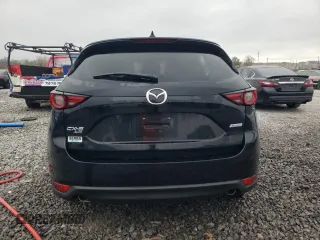 2018 Mazda CX-5 Grand Touring z VIN JM3KFBDM0J0403095, wystawiony jako Copart lot #48594495 z przebiegiem Nie podano mil oraz Szkoda całkowita • Salvage title. Historia ofert i sprzedaży dostępna na DreamBid. Obrazek 6.