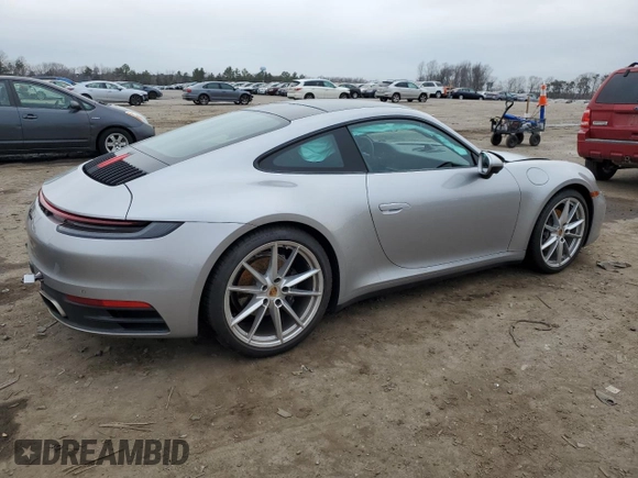 2022 Porsche 911 Carrera with VIN WP0AA2A98NS205474, listed as a Copart auction lot 40023494 with 9,889 mi miles. Bid and sale history available at carsss.com. Image 3.