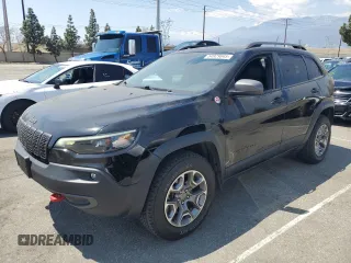 2021 Jeep Cherokee Trailhawk with VIN 1C4PJMBX8MD167153, listed as a Copart auction lot 54929845 with 52,800 mi miles and Clean title. Bid and sale history available at DreamBid. Image 1.