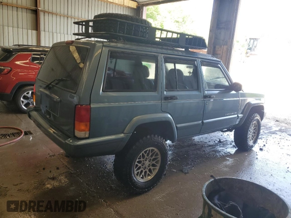 1998 Jeep Cherokee Country with VIN 1J4FT78S8WL252502, listed as a Copart auction lot 59664545 with 133,148 mi miles and Salvage title. Bid and sale history available at DreamBid. Image 3.