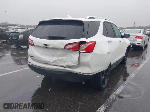 2021 Chevrolet Equinox Premier z VIN 2GNAXNEV7M6112087, wystawiony jako IAAI lot #41102702 z przebiegiem 32 995 mil mil oraz . Historia ofert i sprzedaży dostępna na DreamBid. Obrazek 6.