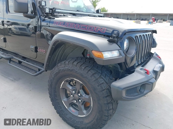 2021 Jeep Gladiator Rubicon z VIN 1C6JJTBG6ML535939, wystawiony jako IAAI lot #42260764 z przebiegiem 114 060 mil mil oraz . Historia ofert i sprzedaży dostępna na DreamBid. Obrazek 17.
