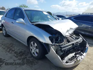 2005 Kia Spectra LX with VIN KNAFE122355139496, listed as a IAAI auction lot 41955660 with 58,676 mi miles. Bid and sale history available at carsss.com. Image 1.