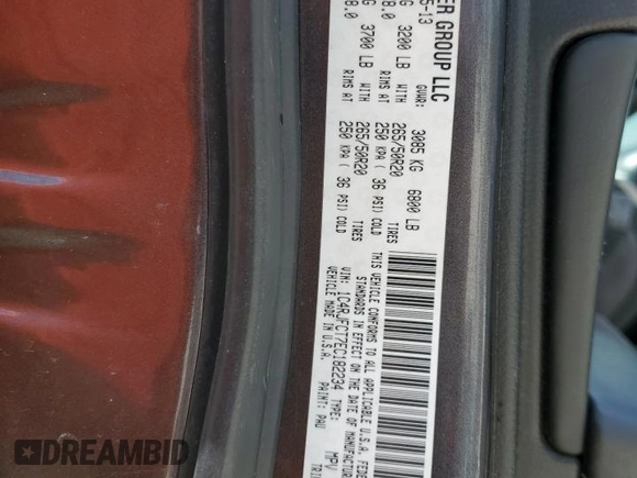 2014 Jeep Grand Cherokee Overland with VIN 1C4RJFCT7EC182234, listed as a Copart auction lot 54754465 with 185,658 mi miles and Salvage Title. Bid and sale history available at DreamBid. Image 14.