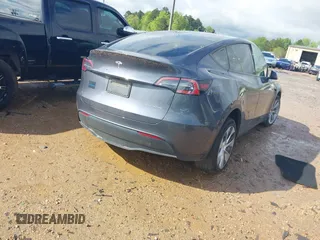 2023 Tesla Model Y Long Range with VIN 7SAYGDEE2PF674286, listed as a IAAI auction lot 42010275 with Not Provided miles and . Bid and sale history available at carsss.com. Image 4.