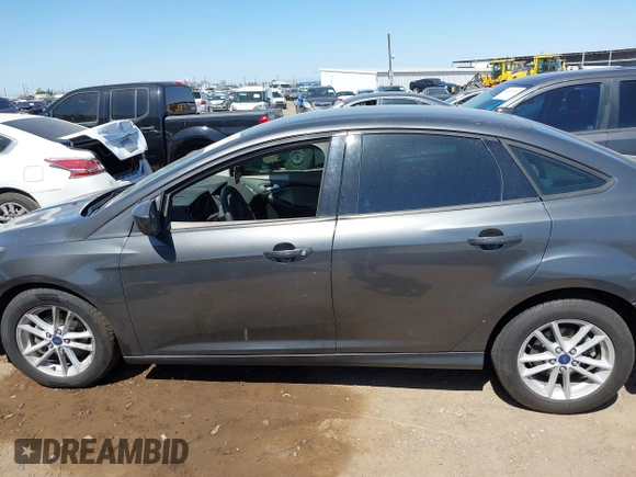 2018 Ford Focus SE with VIN 1FADP3FE6JL270910, listed as a IAAI auction lot 42130371 with 121,240 mi miles. Bid and sale history available at carsss.com. Image 14.