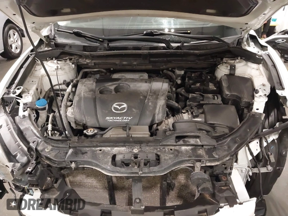 2015 Mazda CX-5 Grand Touring with VIN JM3KE4DY4F0495627, listed as a IAAI auction lot 41887773 with 130,421 mi miles. Bid and sale history available at carsss.com. Image 10.