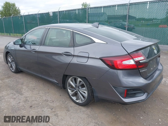 2018 Honda Clarity Touring z VIN JHMZC5F3XJC001054, wystawiony jako IAAI lot #42292688 z przebiegiem 60 780 mil mil oraz . Historia ofert i sprzedaży dostępna na DreamBid. Obrazek 3.
