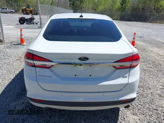 2018 Ford Fusion SE z VIN 3FA6P0H77JR142828, wystawiony jako IAAI lot #41820649 z przebiegiem 208 517 mil mil oraz . Historia ofert i sprzedaży dostępna na DreamBid. Obrazek 16.