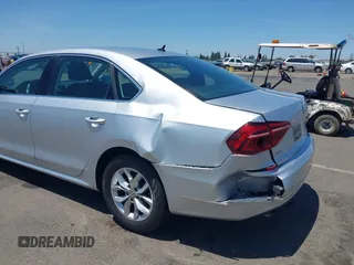 2017 Volkswagen Passat S with VIN 1VWAT7A32HC009657, listed as a IAAI auction lot 42541472 with 100,026 mi miles and . Bid and sale history available at DreamBid. Image 6.
