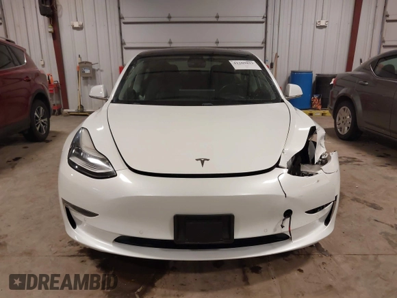 2018 Tesla Model 3 Long Range Battery with VIN 5YJ3E1EB5JF084446, listed as a IAAI auction lot 41209852 with 70,125 mi miles and . Bid and sale history available at DreamBid. Image 13.