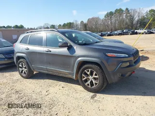 2014 Jeep Cherokee Trailhawk with VIN 1C4PJMBS6EW278987, listed as a IAAI auction lot 41789868 with 136,696 mi miles. Bid and sale history available at carsss.com. Image 1.