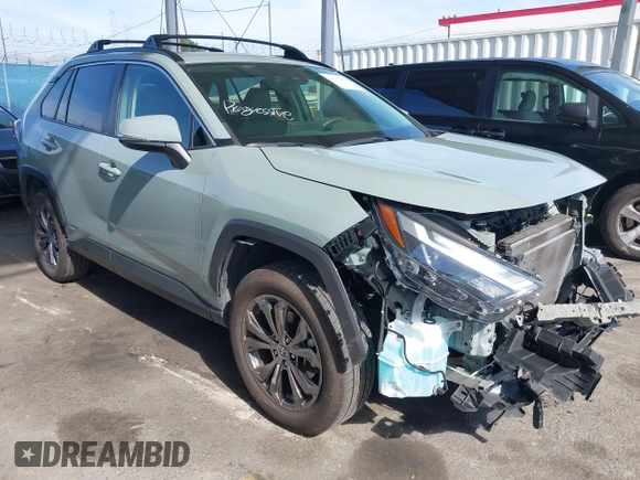 2023 Toyota RAV4 Hybrid XLE Premium with VIN JTMB6RFV8PD086983, listed as a IAAI auction lot 41612674 with 70,817 mi miles. Bid and sale history available at carsss.com. Image 1.