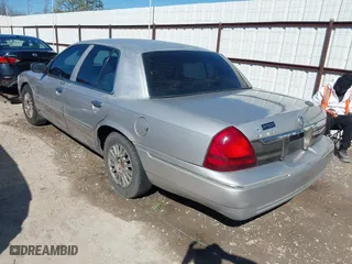 2007 Mercury Grand Marquis LS with VIN 2MEFM75V77X601170, listed as a IAAI auction lot 41517369 with 210,800 mi miles. Bid and sale history available at carsss.com. Image 3.