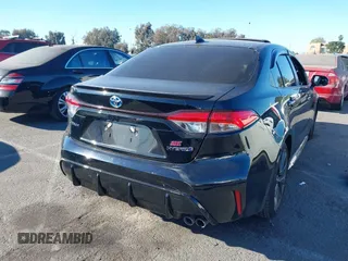 2023 Toyota Corolla Hybrid LE with VIN JTDBCMFE6P3001785, listed as a IAAI auction lot 41337266 with 25,829 mi miles. Bid and sale history available at carsss.com. Image 4.