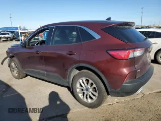 2021 Ford Escape SE with VIN 1FMCU9G67MUA94906, listed as a Copart auction lot 54310725 with 84,595 mi miles and Salvage title. Bid and sale history available at DreamBid. Image 2.
