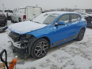 2021 BMW X2 xDrive28i with VIN WBXYJ1C05M5S44997, listed as a Copart auction lot 83067164 with 33,067 mi miles and Salvage Title. Bid and sale history available at carsss.com. Image 1.