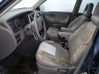 2002 Chevrolet Tracker LT with VIN 2CNBE634126928532, listed as a Copart auction lot 76990704 with Not provided miles and Salvage title. Bid and sale history available at DreamBid. Image 7.