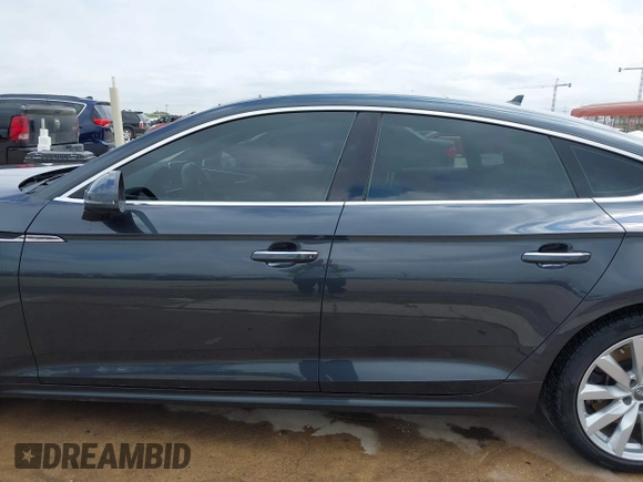 2018 Audi A5 Sportback Premium z VIN WAUANCF5XJA022221, wystawiony jako IAAI lot #42041410 z przebiegiem 94 851 mil mil oraz . Historia ofert i sprzedaży dostępna na DreamBid. Obrazek 14.