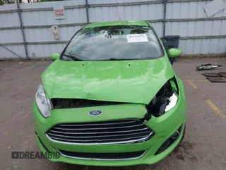 2014 Ford Fiesta Titanium z VIN 3FADP4FJ8EM165941, wystawiony jako IAAI lot #42221629 z przebiegiem 105 582 mil mil oraz . Historia ofert i sprzedaży dostępna na DreamBid. Obrazek 13.