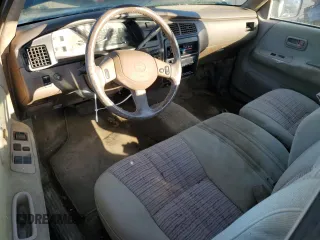1993 Toyota T100 z VIN JT4VD10C2P0007486, wystawiony jako Copart lot #77669724 z przebiegiem 150 936 mil mil oraz Tytuł czysty. Historia ofert i sprzedaży dostępna na DreamBid. Obrazek 8.