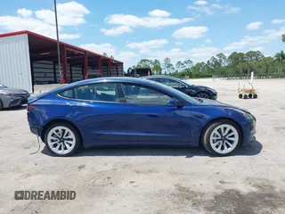 2023 Tesla Model 3 with VIN 5YJ3E1EA0PF658080, listed as a IAAI auction lot 42008846 with 32,301 mi miles and . Bid and sale history available at carsss.com. Image 14.