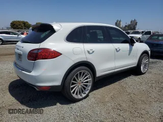 2014 Porsche Cayenne with VIN WP1AA2A28ELA09742, listed as a Copart auction lot 61779285 with 182,380 mi miles and Salvage title. Bid and sale history available at DreamBid. Image 3.