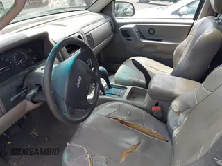 2004 Jeep Grand Cherokee Laredo with VIN 1J4GW48N94C407642, listed as a IAAI auction lot 42381436 with 177,141 mi miles and . Bid and sale history available at DreamBid. Image 5.