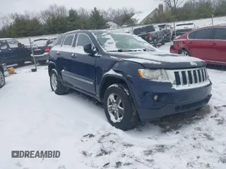 2013 Jeep Grand Cherokee Laredo with VIN 1C4RJFAGXDC542987, listed as a IAAI auction lot 41262770 with 199,273 mi miles. Bid and sale history available at carsss.com. Image 1.