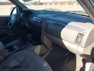 2001 Jeep Grand Cherokee Laredo with VIN 1J4GW48N11C558857, listed as a IAAI auction lot 41527331 with 187,513 mi miles. Bid and sale history available at carsss.com. Image 5.