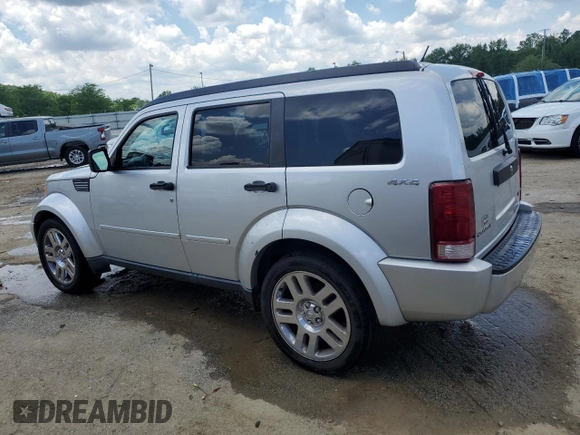 2011 Dodge Nitro Heat with VIN 1D4PU4GK0BW604975, listed as a Copart auction lot 56979275 with 160,494 mi miles and Salvage title. Bid and sale history available at DreamBid. Image 2.