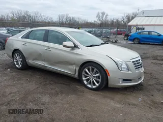 2013 Cadillac XTS Luxury z VIN 2G61R5S30D9174924, wystawiony jako IAAI lot #41958461 z przebiegiem 78 673 mil mil oraz . Historia ofert i sprzedaży dostępna na DreamBid. Obrazek 1.
