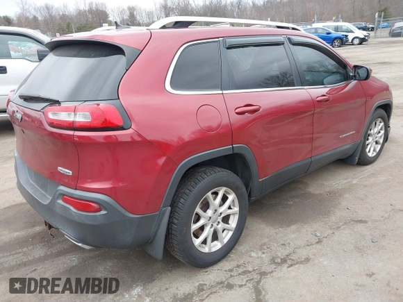 2015 Jeep Cherokee Latitude with VIN 1C4PJMCS6FW594812, listed as a IAAI auction lot 41709068 with 125,232 mi miles. Bid and sale history available at carsss.com. Image 4.