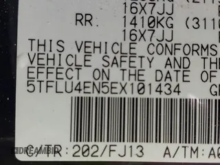 2014 Toyota Tacoma with VIN 5TFLU4EN5EX101434, listed as a IAAI auction lot 42273927 with 216,394 mi miles and . Bid and sale history available at DreamBid. Image 9.