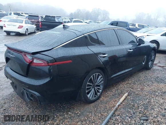 2019 Kia Stinger with VIN KNAE15LA6K6069504, listed as a IAAI auction lot 41031373 with 81,577 mi miles. Bid and sale history available at carsss.com. Image 4.