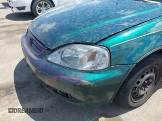 1999 Honda Civic LX z VIN 1HGEJ6672XL044666, wystawiony jako IAAI lot #42343700 z przebiegiem 144 445 mil mil oraz . Historia ofert i sprzedaży dostępna na DreamBid. Obrazek 13.