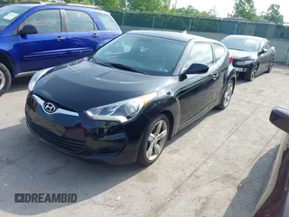 2013 Hyundai Veloster w/Gray Int with VIN KMHTC6ADXDU086856, listed as a IAAI auction lot 42503453 with 187,657 mi miles and . Bid and sale history available at DreamBid. Image 2.