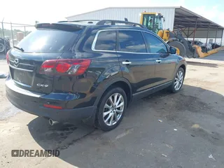 2015 Mazda CX-9 Grand Touring with VIN JM3TB2DA4F0464186, listed as a IAAI auction lot 42227595 with 124,526 mi miles and . Bid and sale history available at DreamBid. Image 4.