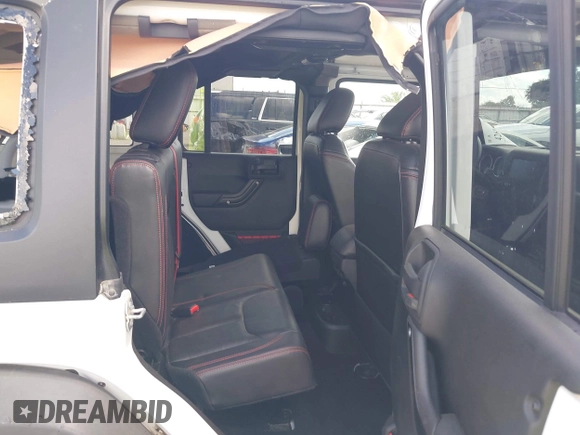 2017 Jeep Wrangler Unlimited Rubicon Recon with VIN 1C4BJWFG1HL693572, listed as a IAAI auction lot 42601855 with 64,342 mi miles and . Bid and sale history available at DreamBid. Image 8.
