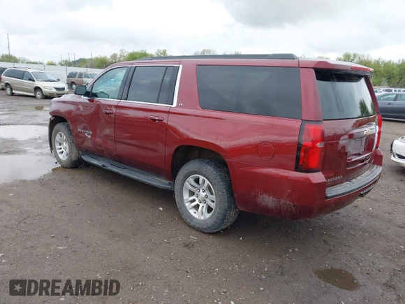 2020 Chevrolet Suburban LT with VIN 1GNSKHKC9LR233603, listed as a IAAI auction lot 41311582 with 104,754 mi miles. Bid and sale history available at carsss.com. Image 3.
