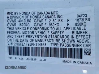 2023 Honda Civic Touring z VIN 2HGFE1F95PH314838, wystawiony jako Copart lot #52545085 z przebiegiem 29 863 mil mil oraz Szkoda całkowita • Salvage title. Historia ofert i sprzedaży dostępna na DreamBid. Obrazek 13.