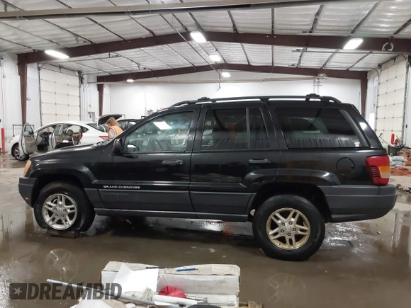 2004 Jeep Grand Cherokee Laredo with VIN 1J4GW48N84C367215, listed as a IAAI auction lot 41352098 with 165,485 mi miles and . Bid and sale history available at DreamBid. Image 14.