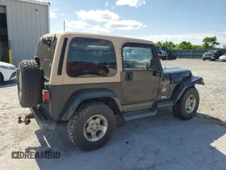 2001 Jeep Wrangler Sahara with VIN 1J4FA59S71P343366, listed as a Copart auction lot 57826405 with 156,436 mi miles and Salvage title. Bid and sale history available at DreamBid. Image 3.