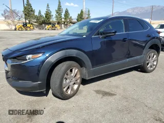 2020 Mazda CX-30 Premium with VIN 3MVDMAEM2LM134841, listed as a Copart auction lot 51979355 with 48,926 mi miles and Salvage title. Bid and sale history available at DreamBid. Image 1.