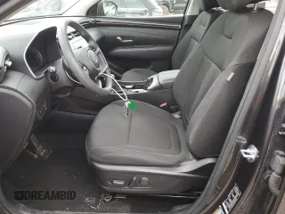 2023 Hyundai Tucson SEL with VIN 5NMJBCAE5PH186784, listed as a Copart auction lot 62896985 with 13,633 mi miles and Salvage title. Bid and sale history available at DreamBid. Image 7.