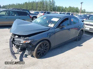 2023 Mazda 3 S Carbon Edition with VIN 3MZBPACM5PM376545, listed as a IAAI auction lot 42404054 with Not provided miles and . Bid and sale history available at DreamBid. Image 2.