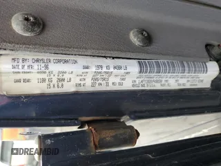 1997 Jeep Wrangler Sport z VIN 1J4FY19S9VP490590, wystawiony jako Copart lot #57492775 z przebiegiem 161 648 mil mil oraz Szkoda całkowita • Salvage title. Historia ofert i sprzedaży dostępna na DreamBid. Obrazek 13.
