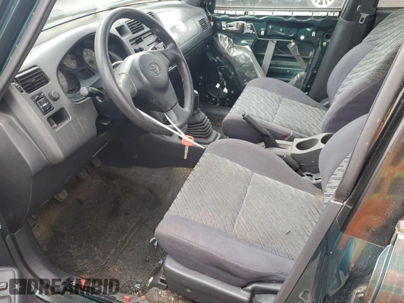 1999 Toyota RAV4 with VIN JT3GP10V2X0037464, listed as a Copart auction lot 54732085 with 306,550 mi miles and Clean Title. Bid and sale history available at DreamBid. Image 7.