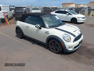 2011 MINI Convertible S with VIN WMWZP3C54BTX84385, listed as a IAAI auction lot 42388603 with 103,336 mi miles and . Bid and sale history available at DreamBid. Image 1.